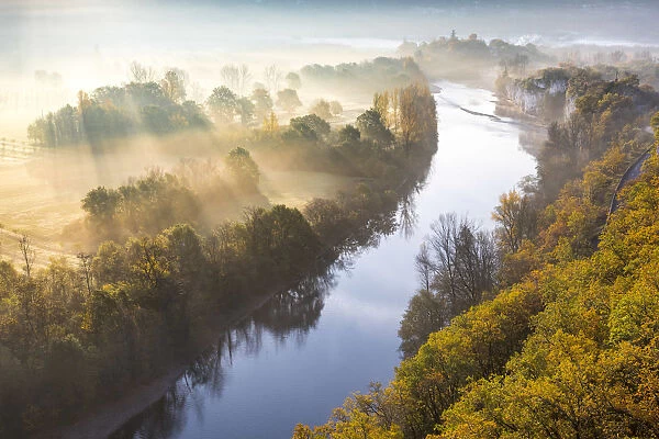 Aerial view of the Dordogne Valley & Dordogne river on a misty morning in autumn, Lot