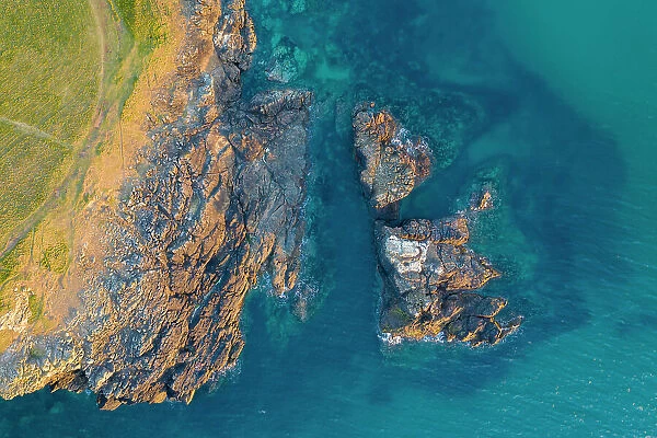 Aerial view of the dramatic Cornish coastline near Trevone Bay in Cornwall, England. Spring (April) 2021