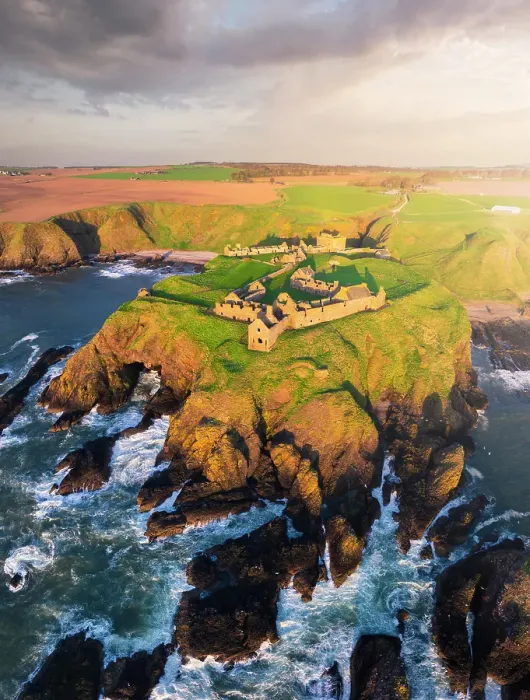 Framed Print : Aerial view of Dunnnottar Castle at sunrise, Stonehaven, Aberdeenshire, Scotland, United Kingdom
