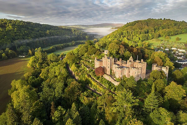 Aerial view of Dunster Castle, Exmoor National Park, Somerset, England. Autumn (October) 2022