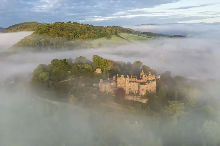 Framed Print : Aerial view of Dunster Castle on a misty autumn morning, Exmoor National Park, Somerset, England. Autumn (October) 2022 Framed Print : Aerial view of Dunster Castle on a misty autumn morning, Exmoor National Park, Somerset, England. Autumn (October) 2022