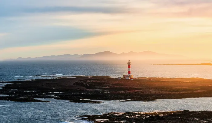 Framed Print : Aerial view of El Toston lighthouse in morning mist at dawn, El Cotillo, Fuerteventura, Canary Islands, Spain