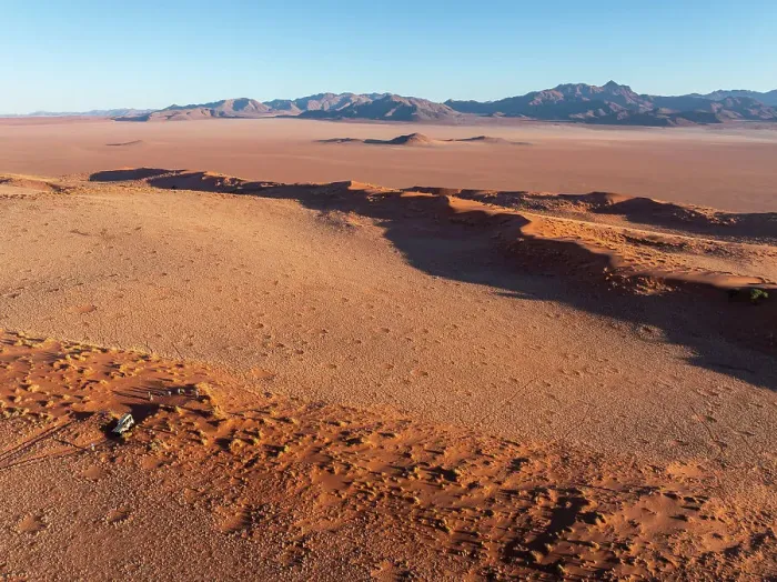 Framed Print : Aerial view of fairy circles, and tourists on safari, Wolwedans, NamibRand Nature Reserve, Namibia, Africa