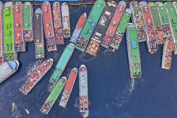 Aerial view of a few ferry boats randomly docked along Buriganga river side in Dhaka city