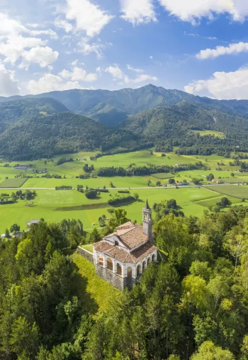 Framed Print : Aerial view of the fields surrounding the small church of Chiesa della Santissima