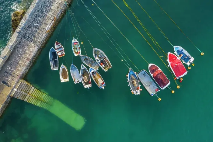 Framed Print : Aerial view of fishing boats in Mevagissey Harbour, Cornwall, England. Spring (June) 2022