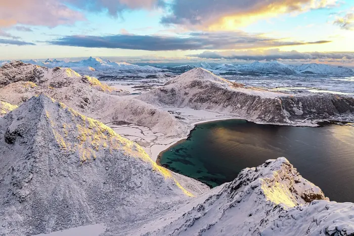 Framed Print : Aerial view of the frozen Haukland beach from the snowy peak of Veggen mountain at dawn, Vestvagoy, Lofoten Islands, Norway Framed Print : Aerial view of the frozen Haukland beach from the snowy peak of Veggen mountain at dawn, Vestvagoy, Lofoten Islands, Norway