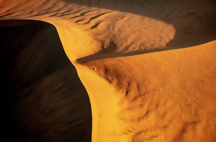 Framed Print : Aerial view of golden sand dunes at sunrise, Sossusvlei, Namib-Naukluft National Park, Namib Desert, Namibia Framed Print : Aerial view of golden sand dunes at sunrise, Sossusvlei, Namib-Naukluft National Park, Namib Desert, Namibia