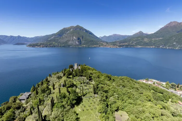 Framed Print : Aerial view of the green hill and castle overlooking Varenna surrounded by Lake Como Framed Print : Aerial view of the green hill and castle overlooking Varenna surrounded by Lake Como