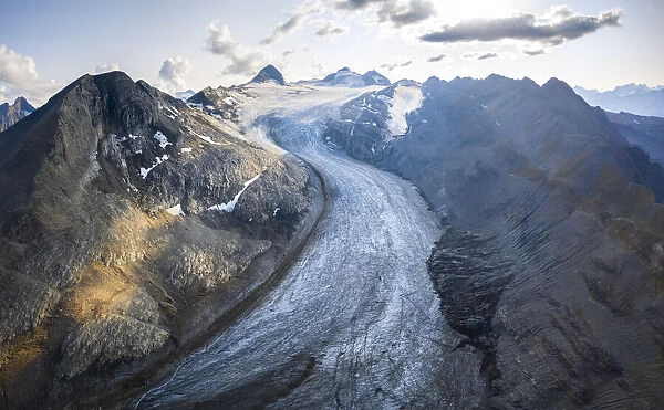 Aerial view of the Gries Glacier winding down from the Blinnenhorn mountain at sunset