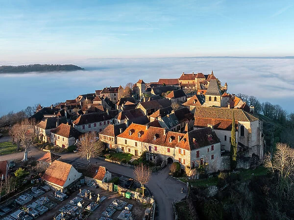 Aerial view of the hilltop village of Loubressac above the fog, Loubressac, Lot, Occitanie, France