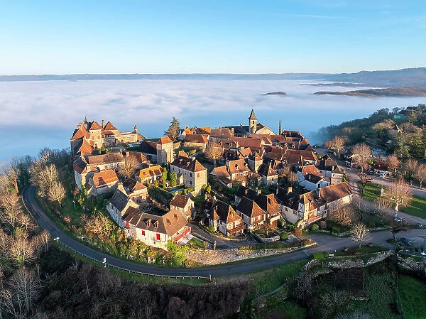 Aerial view of the hilltop village of Loubressac above the fog, Loubressac, Lot, Occitanie, France