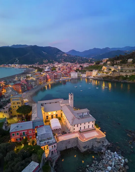 Framed Print : Aerial view of illuminated Sestri Levante and its Baia del Silenzio at sunset, Genova, Liguria, Italy, Southern Europe Framed Print : Aerial view of illuminated Sestri Levante and its Baia del Silenzio at sunset, Genova, Liguria, Italy, Southern Europe