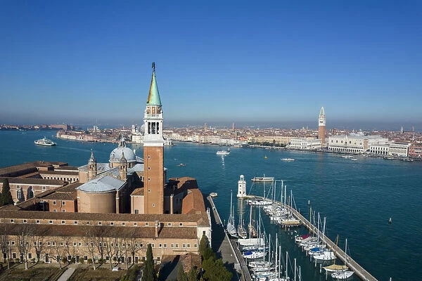 Aerial view of Isola di San Giorgio Maggiore with church San Giorgio Maggiore, San Marco basin, Doges Palace and city centre Venice, Veneto, Italy, Europe. +49, 1 m