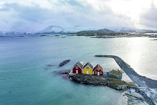 Aerial view of isolated rorbu cabins in the middle of the cold arctic sea, Sommaroy, Troms county, Norway