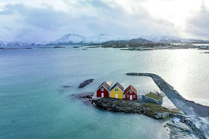 Framed Print : Aerial view of isolated rorbu cabins in the middle of the cold arctic sea, Sommaroy, Troms county, Norway Framed Print : Aerial view of isolated rorbu cabins in the middle of the cold arctic sea, Sommaroy, Troms county, Norway