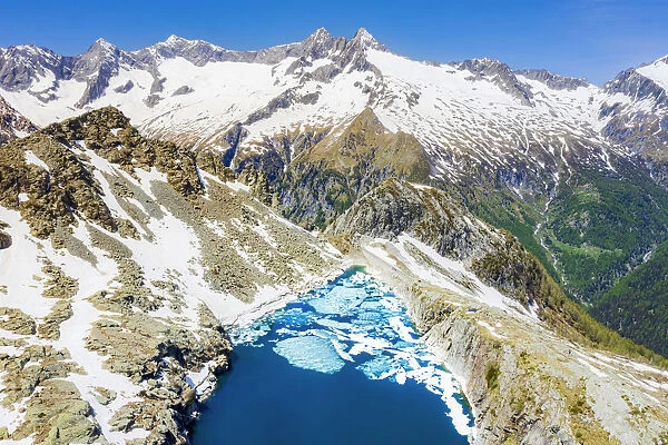 Aerial view of Lago Pirola in summer thaw. Chiareggio, Valmalenco, Valtellina
