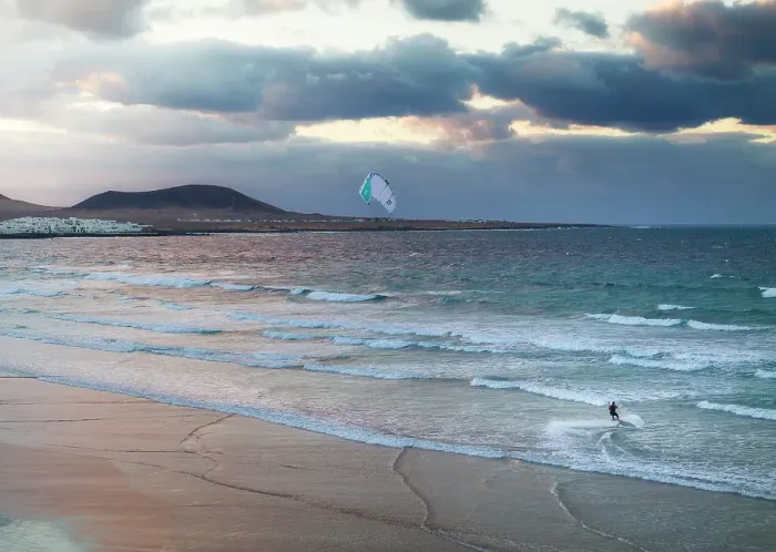 Framed Print : Aerial view of a man kitesurfing at Famara beach with Caleta de Famara in background, Caleta de Famara, Las Palmas, Lanzarote, Canary Islands, Spain Framed Print : Aerial view of a man kitesurfing at Famara beach with Caleta de Famara in background, Caleta de Famara, Las Palmas, Lanzarote, Canary Islands, Spain