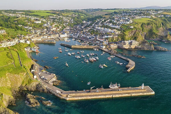 Aerial view of Mevagissey harbour on a sunny summer morning, Cornwall, England. Summer (June) 2022