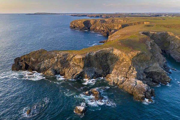 Aerial view of North Cornish rugged coastline in evening light, Park Head, Cornwall