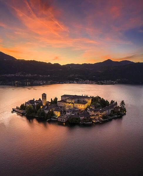 Aerial view of Orta San Giulio and Lake Orta at sunset. Orta Lake, Province of Novara