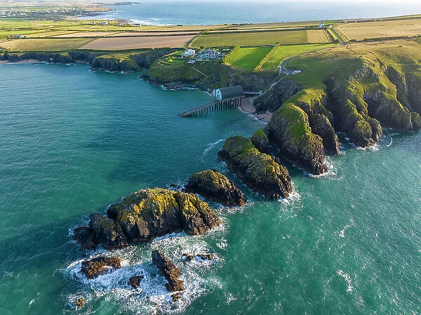 Aerial view of Padstow Lighthouse and Merope Rocks opn Trevose Head, Cornwall, England. Summer (August) 2023