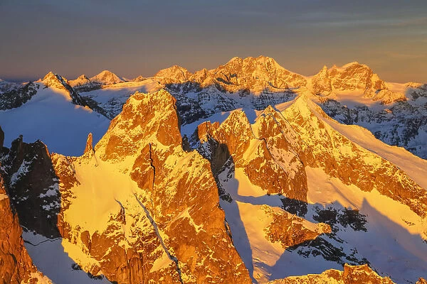 Aerial view of peaks Torrone and Bernina Group at sunset Masino Valley Valtellina