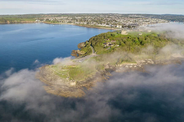 Aerial view of Pendennis Head and Castle on a misty morning, Falmouth, Cornwall, England. Spring (May) 2023