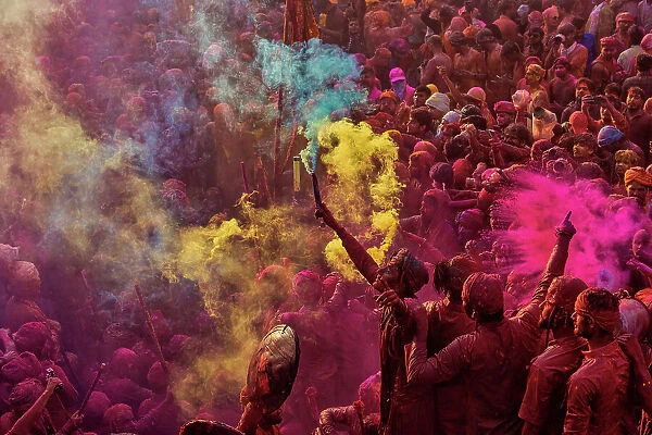 Aerial view of people celebrating the holy colour festival at Shri And Baba Temple, Nandgaon, Uttar Pradesh, India
