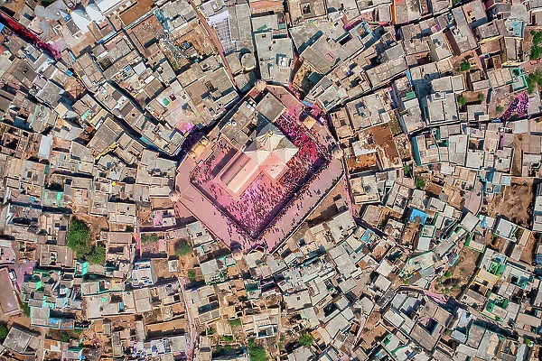 Aerial view of people celebrating the holy colour festival near the Shri And Baba Temple, Uttar Pradesh, India