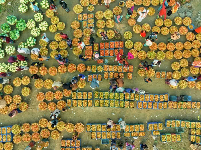 Framed Print : Aerial view of people trading with fruits and vegetables on boats along the river in Brahmanbaria, Bangladesh Framed Print : Aerial view of people trading with fruits and vegetables on boats along the river in Brahmanbaria, Bangladesh