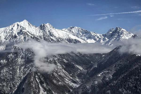 Aerial view of Predarossa Valley in winter with Mount Disgrazia and Corni Bruciati