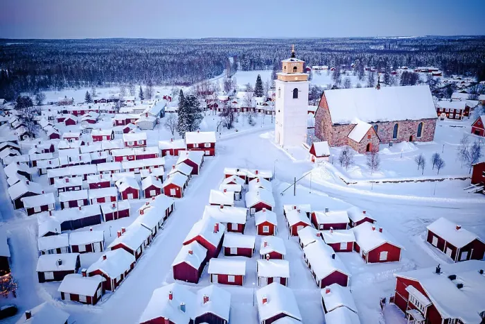 Framed Print : Aerial view of red cabins and church covered with snow at dusk with Lapland forest on background, Gammelstad, Lulea, Sweden Framed Print : Aerial view of red cabins and church covered with snow at dusk with Lapland forest on background, Gammelstad, Lulea, Sweden
