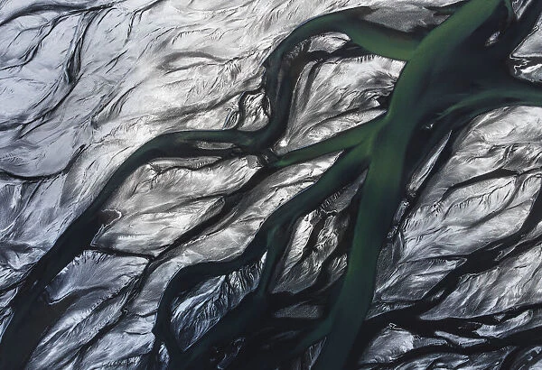 Aerial view of a river delta after a winter snowstorm in the southern part of Iceland. Thorsa river, Iceland