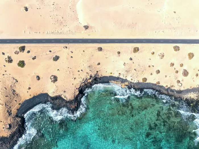 Framed Print : Aerial view of road, desert & sea, Parque Natural de Correlejo, Fuerteventura, Canary Islands, Spain Framed Print : Aerial view of road, desert & sea, Parque Natural de Correlejo, Fuerteventura, Canary Islands, Spain