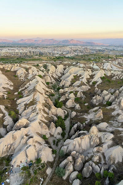 Aerial view of rock formations at sunrise, Goreme, Goreme Historical National Park, Nevsehir District, Nevsehir Province, UNESCO, Cappadocia, Central Anatolia Region, Turkey