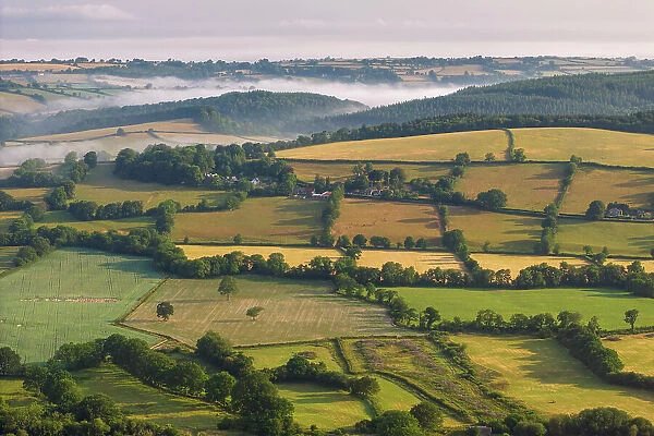 Aerial view of rolling countryside on the outskirts of Dartmoor, Devon, England. Summer (June) 2023