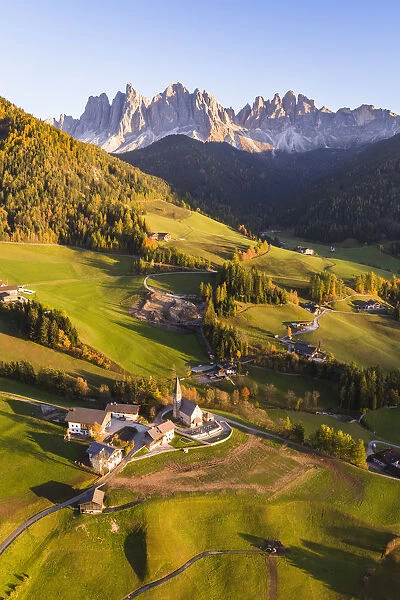 Aerial view of Santa Maddalena town in autumn, Funes valley, Dolomites, Italy