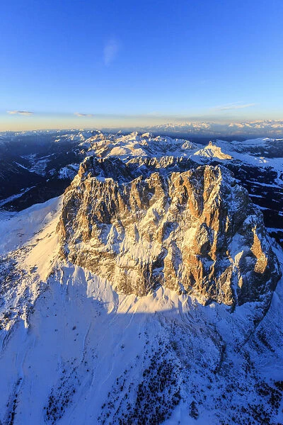 Aerial view of Sassolungo Sassopiatto and Grohmann peak at sunset