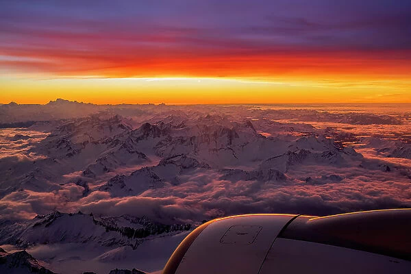 Aerial view of the snowy Bernese Alps at sunset, Switzerland