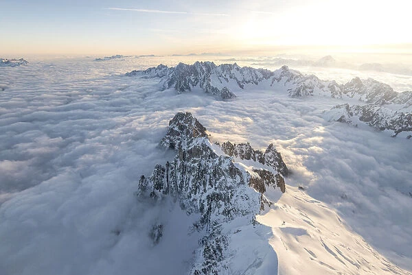 Aerial view of snowy peaks of Mont Blanc during sunrise, Courmayeur, Aosta Valley, Italy