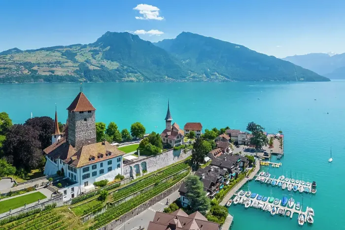 Framed Print : Aerial view of Spiez Castle on shores of lake Thun in summer. Bernese Oberland, Frutigen-Niedersimmental administrative district, Canton of Bern, Switzerland Framed Print : Aerial view of Spiez Castle on shores of lake Thun in summer. Bernese Oberland, Frutigen-Niedersimmental administrative district, Canton of Bern, Switzerland