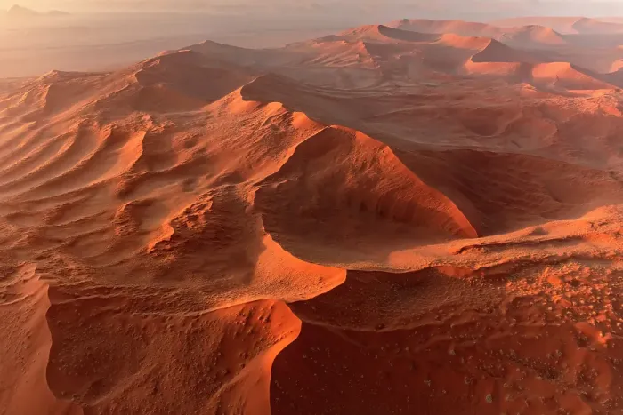 Framed Print : Aerial view of sprawling orange sand dunes at sunrise, Sossusvlei, Namib-Naukluft National Park, Namib Desert, Namibia
