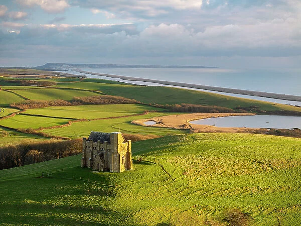 Aerial view of St Catherine's Chapel and Chesil Beach, Abbotsbury, Dorset, England. Winter (January) 2024