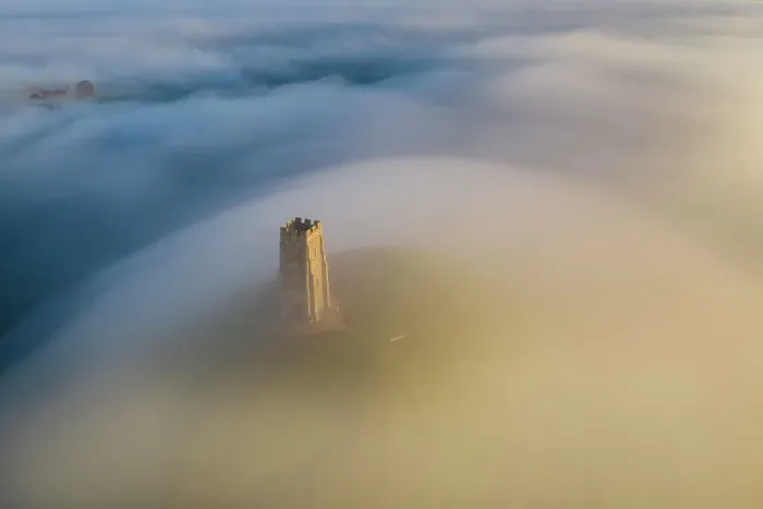 Framed Print : Aerial view of St Michael's Tower on Glastonbury Tor at dawn on a misty morning, Glastonbury, Somerset, England. Autumn (November) 2022 Framed Print : Aerial view of St Michael's Tower on Glastonbury Tor at dawn on a misty morning, Glastonbury, Somerset, England. Autumn (November) 2022