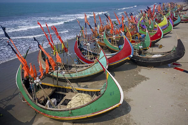Aerial view of traditional fishing boats along the shoreline on the beach on Teknaf