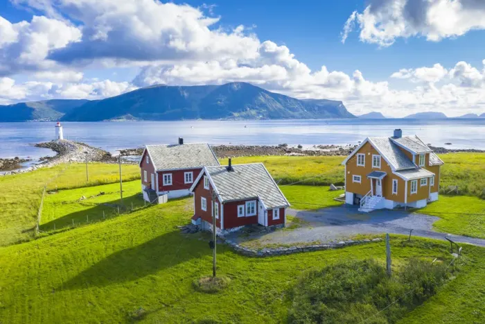 Framed Print : Aerial view of traditional houses and Hogsteinen Lighthouse, Godoya Island, Alesund Framed Print : Aerial view of traditional houses and Hogsteinen Lighthouse, Godoya Island, Alesund