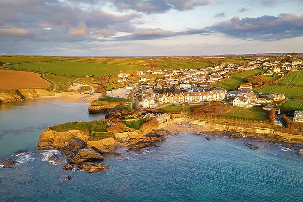 Aerial view of Trevone Bay, beach and village in evening sunlight, Trevone, Cornwall