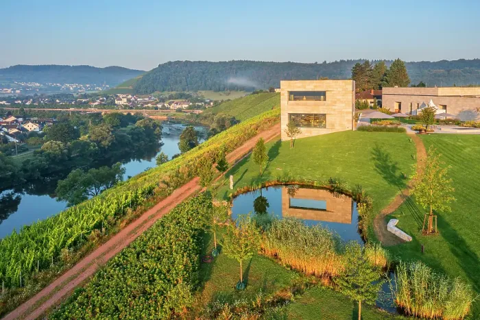 Framed Print : Aerial view at the Van Volxem winery and vinothek with river Saar, Wiltingen, Rhineland-Palatinate, Germany Framed Print : Aerial view at the Van Volxem winery and vinothek with river Saar, Wiltingen, Rhineland-Palatinate, Germany