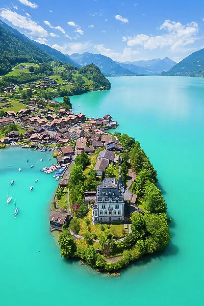 Aerial view of the village of Iseltwald and it's peninsula with the old Castle on Lake Brienz. Iseltwald, Lake Brienz, Bernese Oberland, Interlaken-Oberhasli district, Canton of Bern, Switzerland